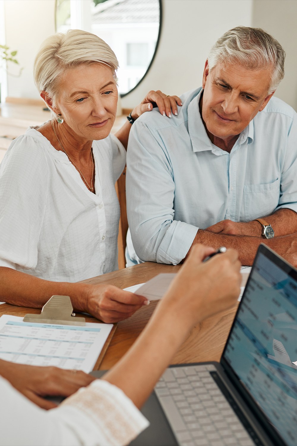 Older couple discussing a retirement plan with agent